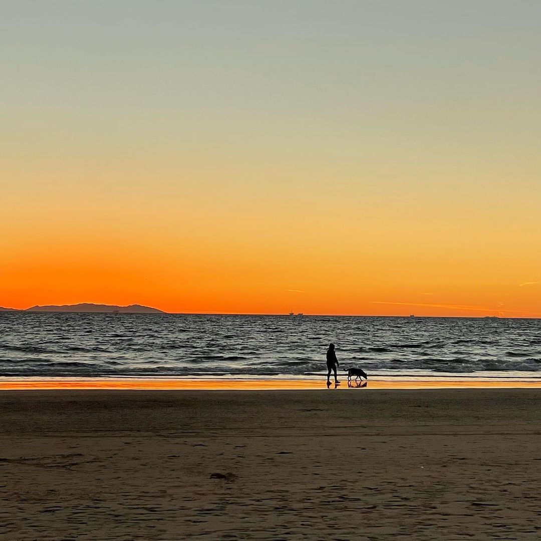 Watch the sunset at Newport Pier